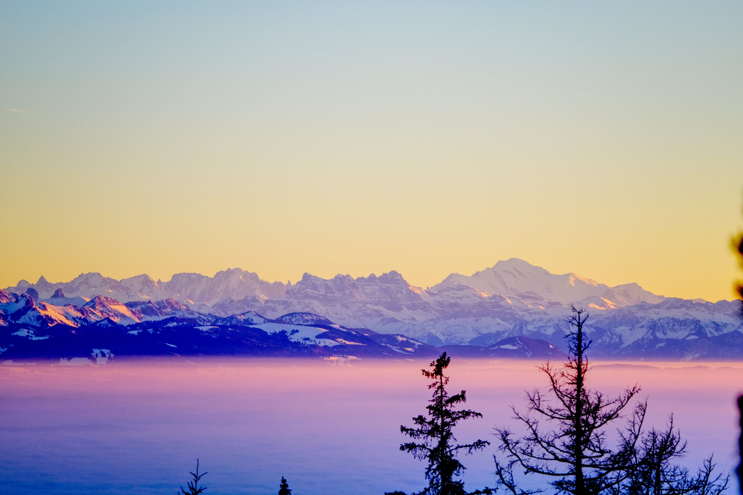 View of the Mt. Blanc and the Alps from Neuchâtel during a winter sunset